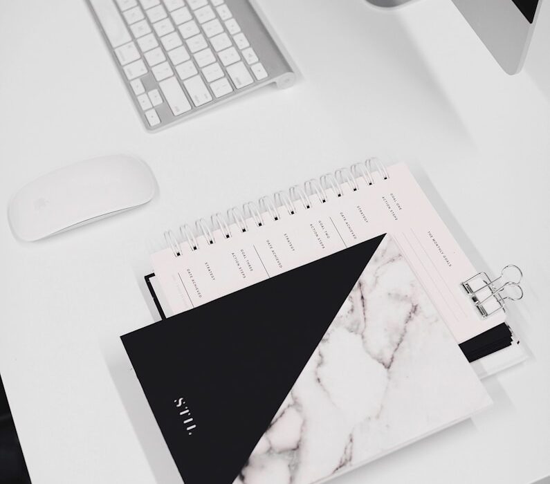 white and black notebook